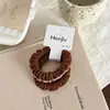 Gomas para el pelo estilo coreano con bloques de color y volantes, con pliegues delicados y tela suave, con un diseño simple de alta elasticidad y una estética retro y suave.