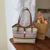 2026 Verano Nueva Moda Simple Gran Capacidad Rayas de Colores Tejida Estilo Vacaciones Bolso de Mano de un Solo Hombro