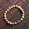 Pulseira de madeira popular com fragrância de leite para meninas bebêA pulseira com contas de Buda de águila-de-odor e anel duplo de leão para homens e mulheres