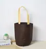 Bolsa de balde não tecida bolsa de fundo redondo bolsa tote para roupas nova moda bolsa tote para roupas infantis pode ser personalizada LOGOTIPO
