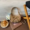 Bolso de Mano Femenino de Lujo Ligero de Nicho Transfronterizo Nuevo Estilo Otoño 2026 Bolso de Moda para el Trabajo Bolso de Media Luna Bolso de Hombro Cruzado