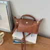 Bolso de Mano de Moda Exquisita Textura 2026 Transfronterizo para Mujer, Bolso Cuadrado Pequeño Versátil Elegante Casual de Hombro Cruzado