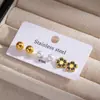 Pendientes de acero inoxidable transfronterizos europeos y americanos para mujer, cuentas redondas de color dorado, estrellas de esmalte negro, juego de pendientes de moda de tres piezas con circonitas