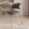Silla de comedor minimalista italiana para el hogar moderna minimalista retro francesa mesa de comedor silla silla de respaldo de diseñador de alta gama de lujo ligero