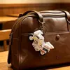 Vehículo de construcción de aleación caricatura creativa mini mochila colgante de llavero clip de regalo muñeco máquina juguete especial venta al por mayor