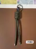 Llavero de cordón de cuero PU transfronterizo, colgante versátil para bolso, accesorios de decoración para botellas de agua y muñecas DIY, llaveros al por mayor