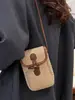 Bolso de paja bicolor para vacaciones en la playa para mujer, nuevo bolso pequeño cruzado de verano 2026, popular bolso tejido a mano para teléfono