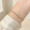 Pulseira de cruz cravejada com diamantes de luxo para mulheres, corrente ajustável de puxar de alta qualidade com corrente tennis cravejada de diamantes, joia elegante para o dia a dia