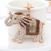Llavero con forma de elefante de metal para coche, colgante con forma de elefante de color, estilo transfronterizo, al por mayor, con dibujos creativos para bolso de escuela.