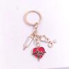 Joyería de comercio exterior Llavero de Mascarilla de Rescate Médico forma de corazón gorra de enfermera jeringa estetoscopio llavero de temperatura corporal