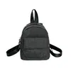 Mochila de cuadros de color sólido para mujer, nuevo estilo 2026, casual, ligera, versátil, bolsa de viaje color vino tinto, mini mochila