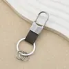 Llavero de Cuero Simple Personalizado Moda para Hombre Colgante de Cintura Llavero de Coche Almacenamiento en Casa Anti-pérdida Colgante con Hebilla en U
