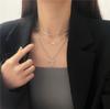 Cadena de suéter con colgante de corazón calado multicapa simple nuevo japonés y coreano, cadena para clavícula de diseño artístico de lujo accesible a la moda para mujer