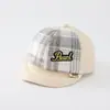 Al por mayor Otoño 2026 Lana Cálida Gorra de Pato para Bebé Estilo Coreano Serie a Cuadros para Niños y Niñas Sombrero de Ala Suave de Moda para Bebé