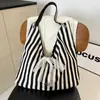 Estilo coreano retro bolsa de gran capacidad para mujer bolsa de lona bordada estilo Ins simple con letras para ropa de trabajo bolsa de hombro versátil