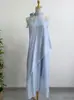 Vestido francés sin mangas con cuello halter y tirantes para mujer Verano 2025 Nuevo Vacaciones junto al mar Falda larga asimétrica