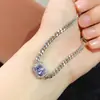 Venta al por mayor de fábrica explosiones pulsera de tanzanita natural plata S925 incrustada piedra principal 4*6 vendiendo Europa y Estados Unidos una generación de cabello