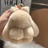 Llavero de Conejo Rex de Piel Genuina Lazo Lindo Conejo Llavero de Coche Adorable Conejo de Orejas Caídas Juguete de Peluche Colgante de Bolsa Conejo de Peluche