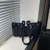 Bolso de mano estilo coreano para mujer, nuevo bolso de hombro único de moda 2026, estampado de leopardo único con remaches, bolso tote de gran capacidad para mujer