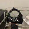 Verano 2025 Nuevo Versátil Moderno Estilo Ins Bolso Dumpling Textura de Cuero Suave Bolso de Mano Diseño Nicho Bolso de Mujer