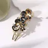 Accesorios para el Cabello Estilo Coreano Pinza para el Cabello con Mariposa y Pedrería Pinza de Tres Picos Pinza para el Cabello Adorno para el Cabello Pinza de Pato al por Mayor desde Fabricante