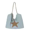 Bolso de hombro para mujer con un diseño de alta gama, moderno, versátil y de gran capacidad para ir al trabajo, bolso tote con diseño de nicho estilo coreano con forma de estrella