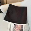 Falda de traje de lunares con retazos de encaje con volantes estilo francés para mujer, falda corta de cintura alta línea A 2026 otoño con diseño anti-exposición