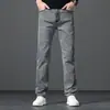 Jeans de tiro alto para hombre 2026 otoño nuevo versátil rectos elásticos ajustados estilo coreano pantalones largos ropa de hombre