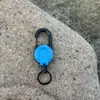 Hebilla retráctil táctica para acampar al aire libre, cable de acero, llavero multifuncional, cuerda de rebote anti-pérdida para acampar, fácil de tirar