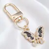 Llavero de Mariposa de Esmalte Blanco y Negro de Gama Alta, Colgante Completo de Diamante, Mariposa Combinada con Colgante de Oro, Llavero DIY, Colgante Pequeño