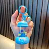 Llavero Lindo de Exprimidor Mini Fabricador de Jugo Colgante Juguete para Niños Encanto de Mochila Máquina de Garra Regalo Pequeño Venta al por Mayor