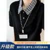 Camisa Polo para hombre estilo americano de dos piezas falsas, diseño de verano 2026, cuello de camisa a cuadros con manga corta y patchwork