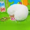 Venta caliente llavero de felpa de amor llavero de bola de pelo de corazón de melocotón colgante accesorios para equipaje de dama coche al por mayor