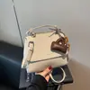 Bolso Pequeño Serie Niu para Mujer Estilo Nuevo 2025 Nicho Retro Casual Moda Versátil Bolso de Hombro Cruzado