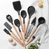 Set de diez piezas de utensilios de cocina de silicona negra con tubo de almacenamiento negro antiadherente, espátula de cocina y juego de cucharas de silicona suave