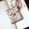Muestra de pedido final se puede pedir bolsa de tela de brocado para regalo bolsa Wenwan estilo japonés bolsa de almacenamiento de joyas billetera plegable tela