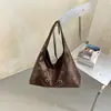 2026 Verano Diseño de Nicho Moda Bolso de Mano Casual Personalidad Bolso de Hombro Simple Moderno Anillo con Remaches Bolso para Mujer
