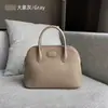 Bolso de mano para mujer, primavera y verano 2023, de piel auténtica, sencillo, moderno, informal, retro, portátil.