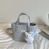 Bolsa pequena feminina 2026 novo modelo primavera-verão, textura de alta qualidade, design de nicho, bolsa transversal versátil vintage, bolsa de mão tipo balde