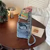 Bolso nuevo de mezclilla para mujer, bolso cruzado largo para teléfono con un toque de alta gama, bolso de hombro versátil de tela lavada casual