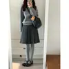 Item quente do Xiaohongshu~ Saia midi plissada estilo preppy outono/inverno em mistura de lã cinza escuro para mulheres, cintura alta, saia evasê que afina