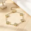 Elegante collar de trébol de cuatro hojas de la suerte incrustado con diamantes, nicho de lujo ligero, moda transfronteriza versátil, collar de acero de titanio que no se decolora para mujer
