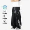 Pantalones casuales a rayas estilo americano para hombre, verano 2026, finos, para exteriores, con bloques de color, deportivos, holgados, de pierna recta, de marca moderna.