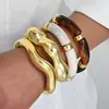 Accesorio transfronterizo de gran venta, producto nuevo: brazalete abierto de forma de ola irregular para mujer, conjunto de tres piezas personalizado y de moda de joyería para mujer