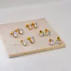 E149 Pendientes Transfronterizos de Acero Inoxidable con Circonita Pendientes Sencillos Galvanoplastia al Vacío en Horno Joyería de Oro de 18 Quilates