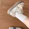 Zapatillas de entrenamiento alemanas de moda, elegantes y versátiles con estampado de estrellas para mujer, una nueva colección de otoño 2026 de zapatillas casuales blancas de nicho