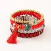 Bestseller transfronterizo estilo bohemio ojo turco borla colgante pulsera multicapa cordón elástico pulsera de cuentas