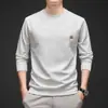 Artículo popular para transmisiones en vivo: Camiseta de manga larga para hombre, de corte holgado, cuello redondo y estampado floral, para otoño e invierno