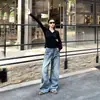 Jeans Pesado Lavado Novo Outono/Inverno 2026 de Cintura Baixa Solto Wide Leg para Mulheres