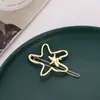 Novos acessórios de moda feminina europeus e americanos acessórios de cabelo irregulares adorno de cabeça estrela-do-mar oca brilhante grampo